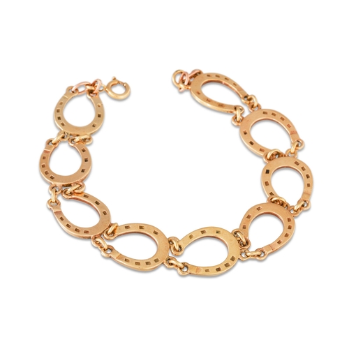 5 - A 9CT GOLD BRACELET, horse shoe links,12 g.