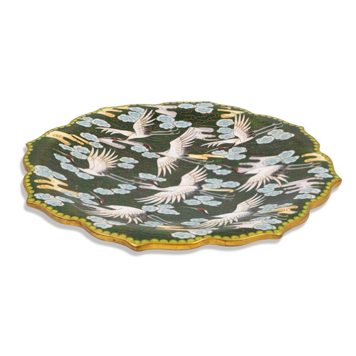 584 - A JAPANESE PLATE DEPICTING CRANES, on a green palette