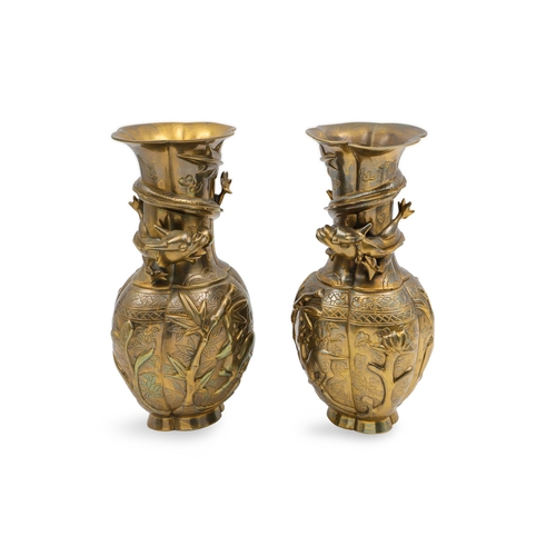 586 - A PAIR OF ORIENTAL STYLE BRASS VASES, cast with recumbent deer, bamboo, and dragon motifs, 20th cent... 