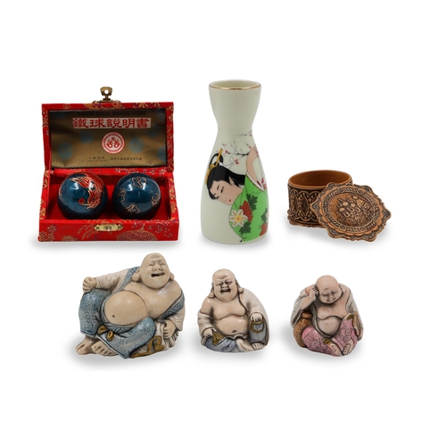 587 - A SMALL MODERN CHINESE PORCELAIN SPILL VASE, three models of Buddha, Yin Yang health balls, and a sm... 