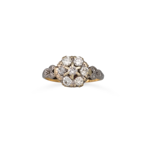 9 - A DIAMOND CLUSTER RING, the brilliant cut diamonds mounted in 18ct gold. Estimated: weight of diamon... 