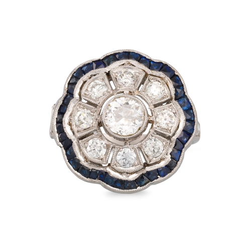 295 - A VINTAGE DIAMOND AND SAPPHIRE DAISY CLUSTER RING, the central old cut diamond to a diamond & sapphi... 