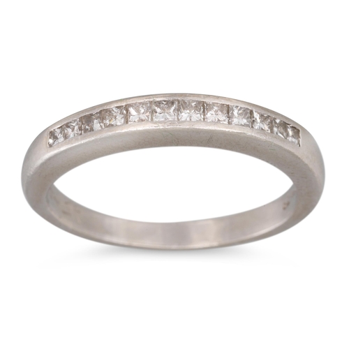 316 - A DIAMOND HALF ETERNITY RING, channel set with princess cut diamonds, mounted in platinum, size M