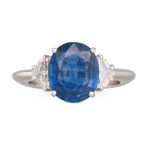 343 - A SAPPHIRE AND DIAMOND RING, the oval sapphire to trillion cut diamond shoulders, mounted in 18ct wh... 