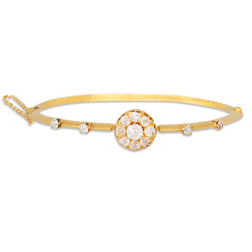 359 - AN ANTIQUE DIAMOND BANGLE, set to the centre with an old cut diamond cluster, mounted in yellow gold... 