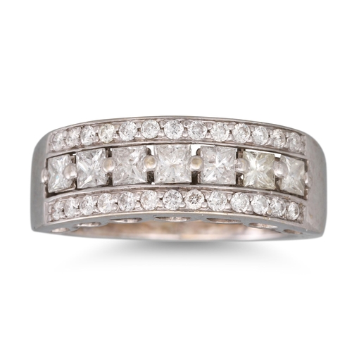 365 - A DIAMOND TRIPLE ROWED RING, the row of princess cut stones flanked by round brilliant cut diamonds ... 