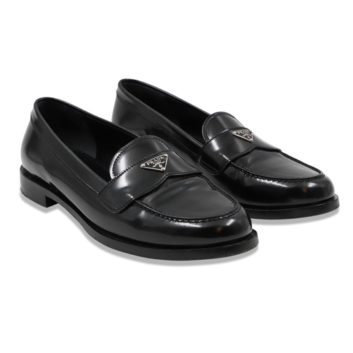 411 - A PAIR OF PRADA LADY'S SLIP ON SHOES, size 37.5 eu Condition is very good