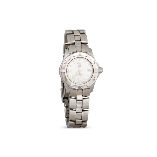 434 - A LADY'S TAG HEUER STAINLESS STEEL WRISTWATCH, date, grey face & box