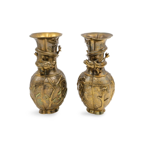 489 - A PAIR OF ORIENTAL STYLE BRASS VASES, cast with recumbent deer, bamboo, and dragon motifs, 20th cent... 