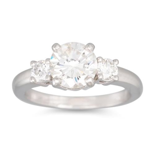 220 - A DIAMOND SOLITAIRE RING, the brilliant cut diamond to diamond shoulders, mounted in platinum. Estim... 