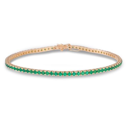 240 - AN EMERALD TENNIS BRACELET, the circular stones mounted in 18ct yellow gold. Estimated: weight of em... 