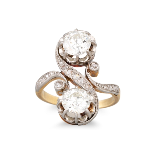 283 - AN EDWARDIAN DIAMOND TOI ET MOI RING, set with old and rose cut diamond detail, in yellow and white ... 