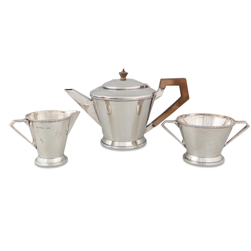 380 - A MODERN SILVER THREE PIECE TEA SERVICE OF SHAPED PLAIN FORM, comprising a tea pot, twin handled sug... 