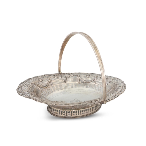 395 - A GEORGE III CAKE BASKET, Dublin 1780, in the Adam style, O'Byrne crest