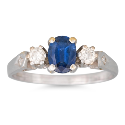 114 - A THREE STONE SAPPHIRE AND DIAMOND RING, mounted in 18ct white gold, size P