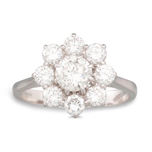 229 - A DIAMOND CLUSTER RING, the brilliant cut diamonds mounted in 18ct white gold. Estimated: weight of ... 