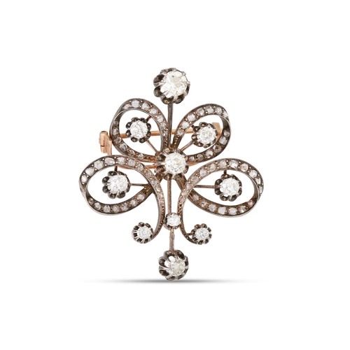 306 - AN ANTIQUE DIAMOND BROOCH, of scrolled openwork form, set with old cut diamonds. Estimated: weight o... 