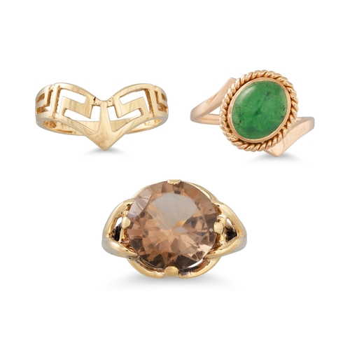 137 - A TOPAZ RING, mounted in 10ct gold, size M, together with a 14ct gold cabochon ring, size O and a 14... 