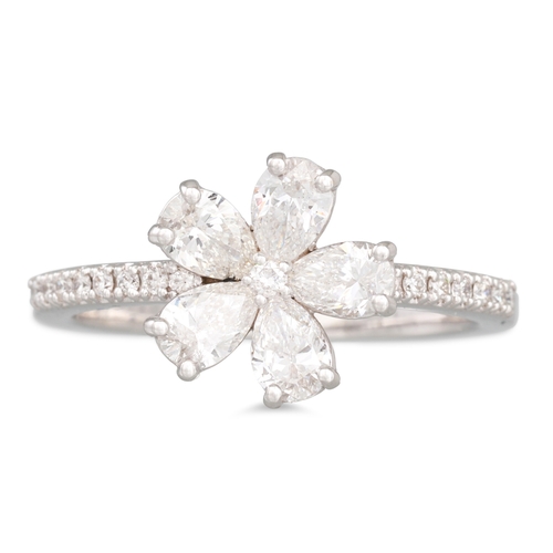 A DIAMOND FLOWER CLUSTER RING, the brilliant cut and pear cut diamonds ...