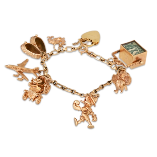 2 - A 9CT GOLD CHARM BRACELET, with various charms attached, gross weight 37 g.