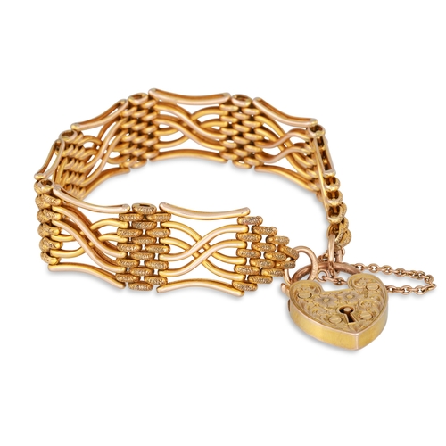 20 - A 9CT GOLD GATE BRACELET, with padlock, engraved decoration, 23 g.