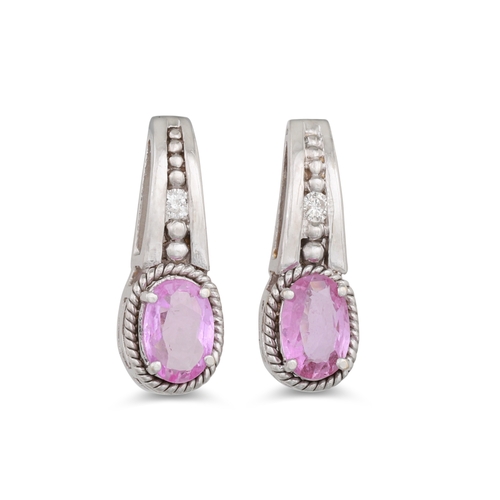 24 - A PAIR OF DIAMOND AND PINK SAPPHIRE EARRINGS, the oval sapphire to diamond surround mounted in white... 