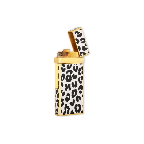 25 - A YVES SAINT LAURENT ENAMEL LIGHTER, black & white design