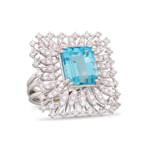 268 - A TOPAZ AND DIAMOND RING, the trap cut topaz to a light pink diamond surround, mounted in white gold... 