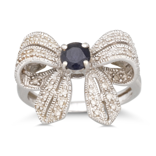 27 - A DIAMOND AND GEM SET RING, modelled as a bow, mounted in white gold. Size: N - O