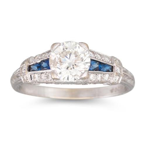 285 - A DIAMOND AND SAPPHIRE RING, the brilliant cut diamond to a channel set sapphire and diamond mount, ... 