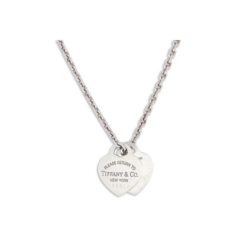 67 - A SILVER TIFFANY PENDANT, stamped 'I Love you, Tiffany & Co.' on a silver chain