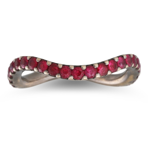 36 - A RUBY ETERNITY RING, of oval wavy design, mounted in 18ct gold, with black rhodium plating, size M ... 