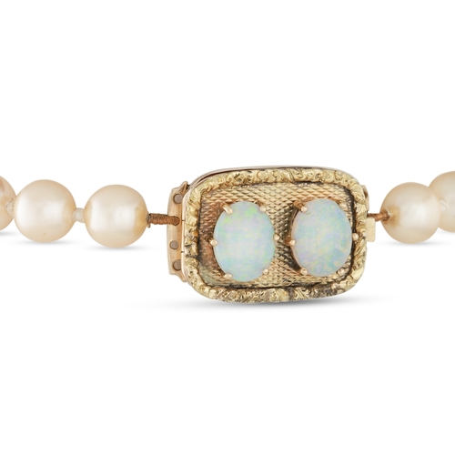 40 - A SET OF VINTAGE CULTURED PEARLS, with a gold and opal clasp, dated 1934 verso