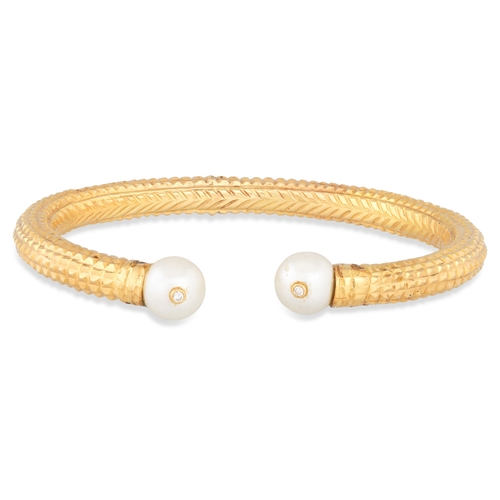 85 - AN INDIAN 22 CT GOLD BANGLE, pearl and diamond set