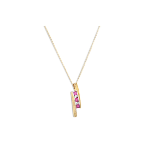 95 - A RUBY AND DIAMOND PENDANT, mounted in 9ct yellow gold, on a chain