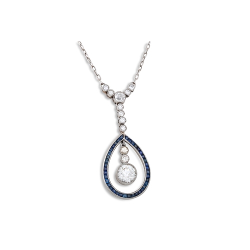 112 - AN EDWARDIAN DIAMOND AND SAPPHIRE DROP PENDANT, the old cut diamond drops within a pear shaped sapph... 