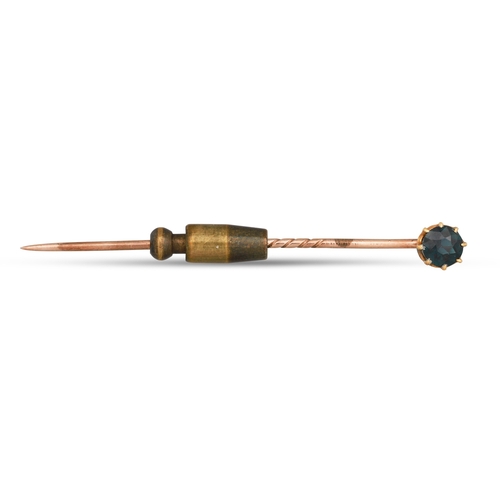 117 - A GEM SET TIE PIN, mounted in 9ct gold, 14ct gold head