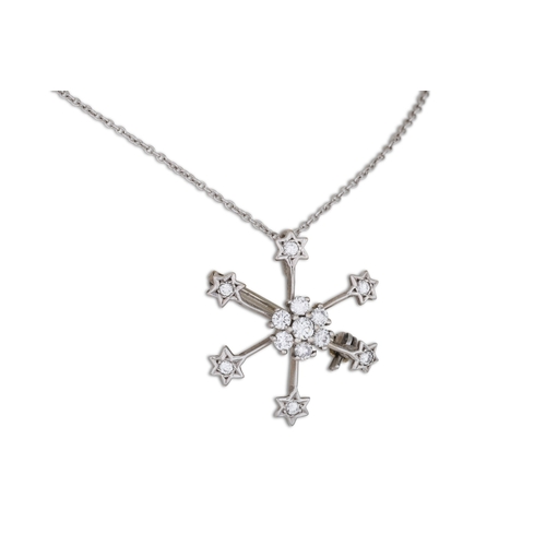 123 - A DIAMOND SNOWFLAKE PENDANT/BROOCH, on a chain, mounted in 18ct white gold. Estimated: weight of dia... 