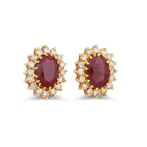 19 - A PAIR OF RUBY AND DIAMOND CLUSTER EARRINGS, the oval rubies to a diamond surround, mounted in 18ct ... 