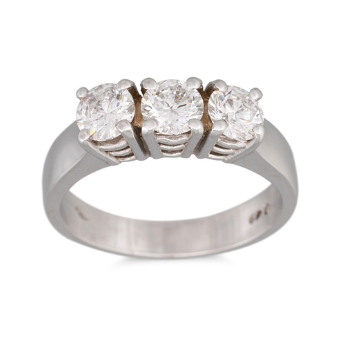 195 - A THREE STONE DIAMOND RING, the brilliant cut diamonds mounted in 18ct white gold. Estimated: weight... 