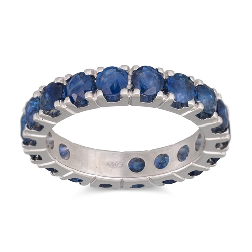 255 - A SAPPHIRE FULL ETERNITY RING, mounted in 18ct white gold. Estimated: weight of sapphires: 3.68 ct, ... 