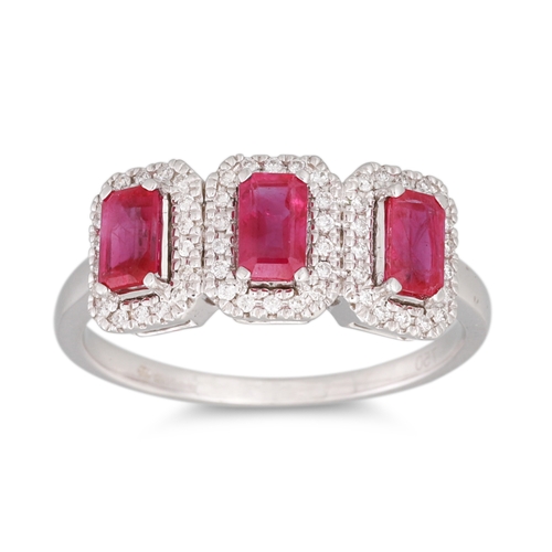 29 - A THREE STONE RUBY AND DIAMOND CLUSTER RING, mounted in 18ct white gold, size N
