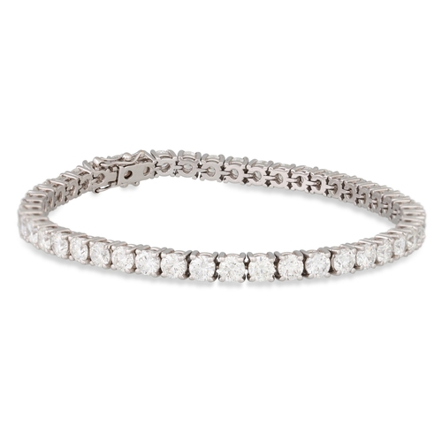 292 - A DIAMOND LINE BRACELET, the brilliant cut diamonds mounted in 18ct white gold. Estimated: weight of... 