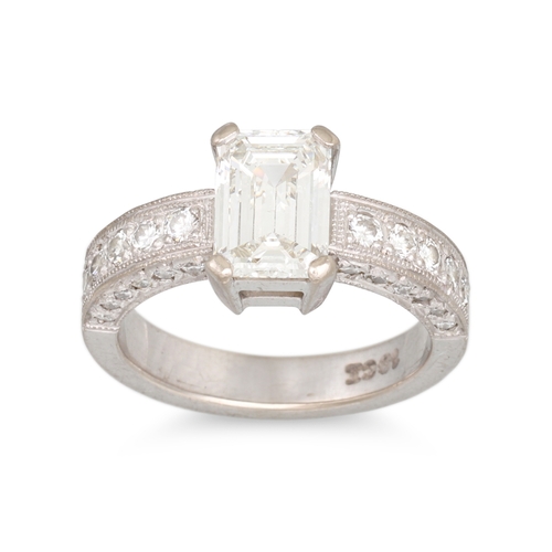 325 - A DIAMOND SOLITAIRE RING, the emerald cut diamond to diamond set shoulders, mounted in 18ct white go... 