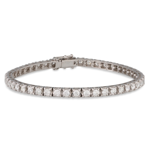 336 - A DIAMOND LINE BRACELET, the brilliant cut diamonds, mounted in 18ct white gold. Together with a HRD... 