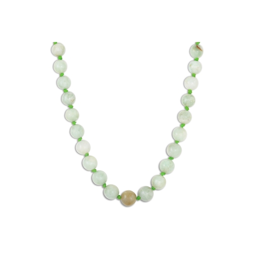 359 - A JADE NECKLACE, beaded and knotted