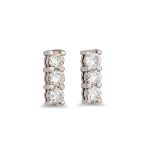 65 - A PAIR OF THREE STONE DIAMOND EARRINGS, in white gold. Estimated: weight of diamonds: 0.60 ct.
