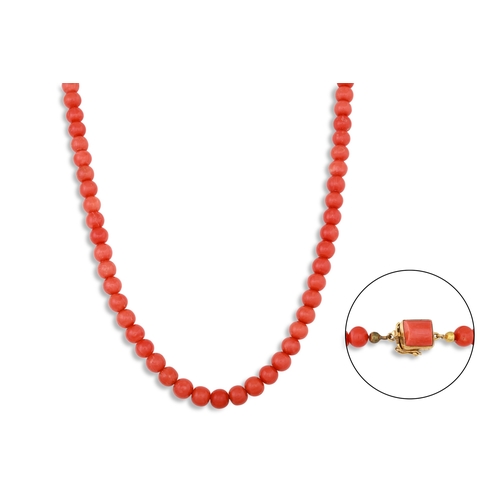 69 - A VINTAGE BEADED CORAL NECKLACE, to a coral set 18ct gold clasp