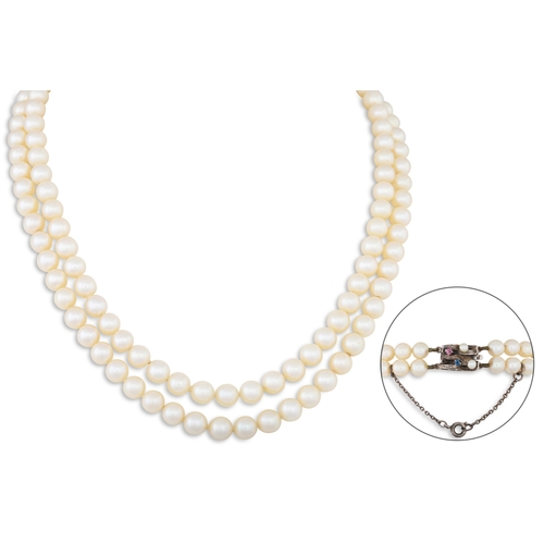 70 - A SET OF VINTAGE DOUBLE STRANDED CULTURED PEARLS, to a 14ct gold clasp set with pearl, ruby and sapp... 