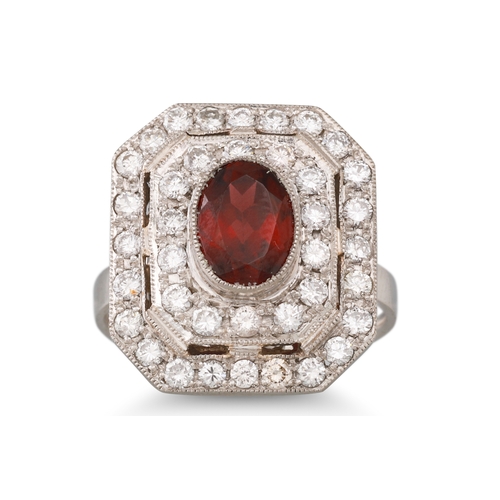 146 - A GARNET AND DIAMOND PLAQUE RING, the oval garnet to a two rowed diamond surround, mounted in white ... 